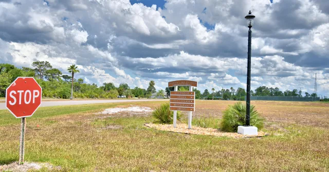a backyard of a house with barbeque oven