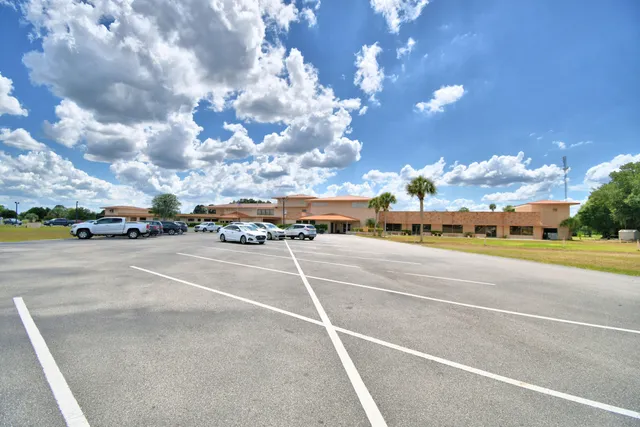 a view of backyard with large trees