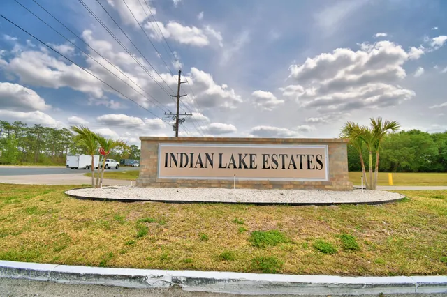 a view of a swimming pool and an outdoor seating