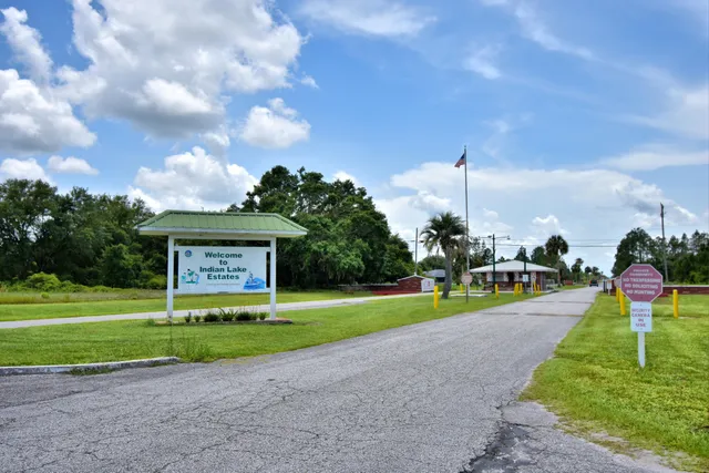a view of a house with basketball court