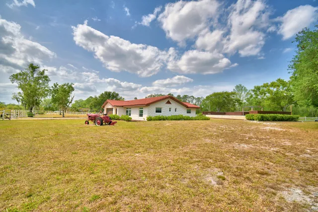 a kitchen with stainless steel appliances granite countertop a stove and a refrigerator