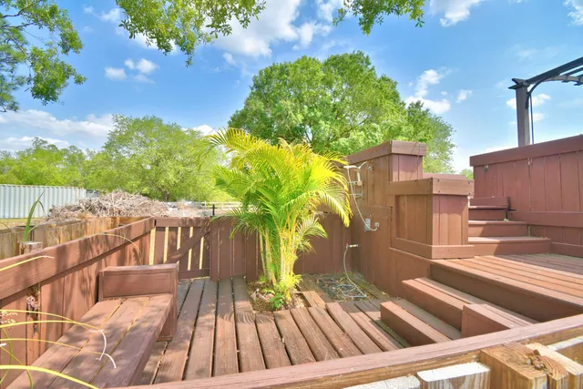 a living room with furniture and a lamp