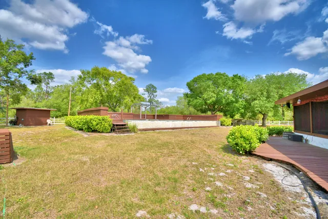 a view of swimming pool with a yard