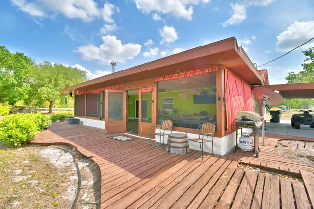 a front view of house with yard and outdoor seating