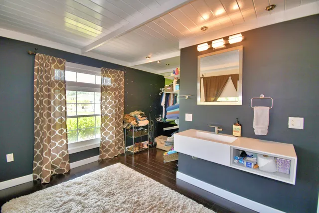 a view of backyard with swimming pool