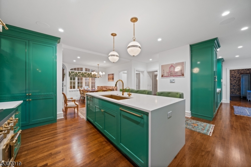 655 Lake Street Newark, NJ 07104 - Photo 16 of 49 a kitchen with sink stove and wooden floor