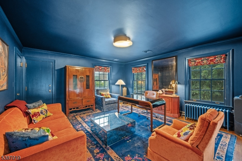 655 Lake Street Newark, NJ 07104 - Photo 35 of 49 a living room with furniture a floor to ceiling window and potted plant
