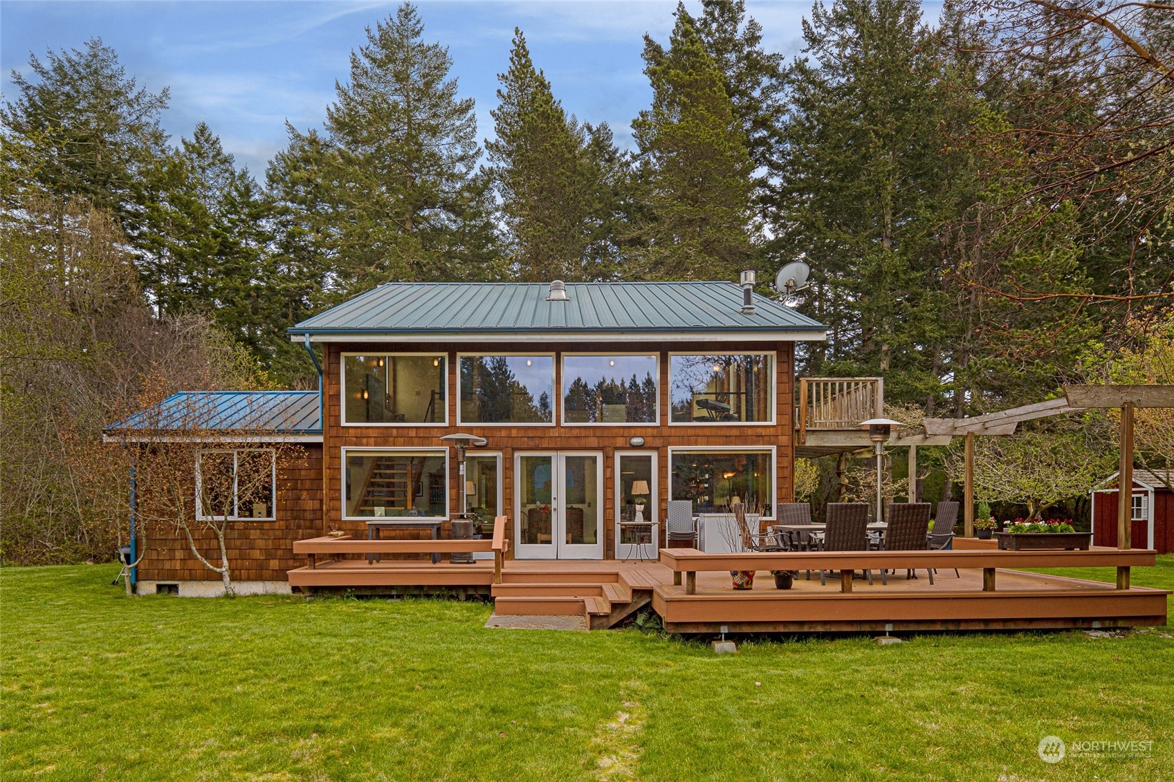 a front view of a house with a yard table and chairs