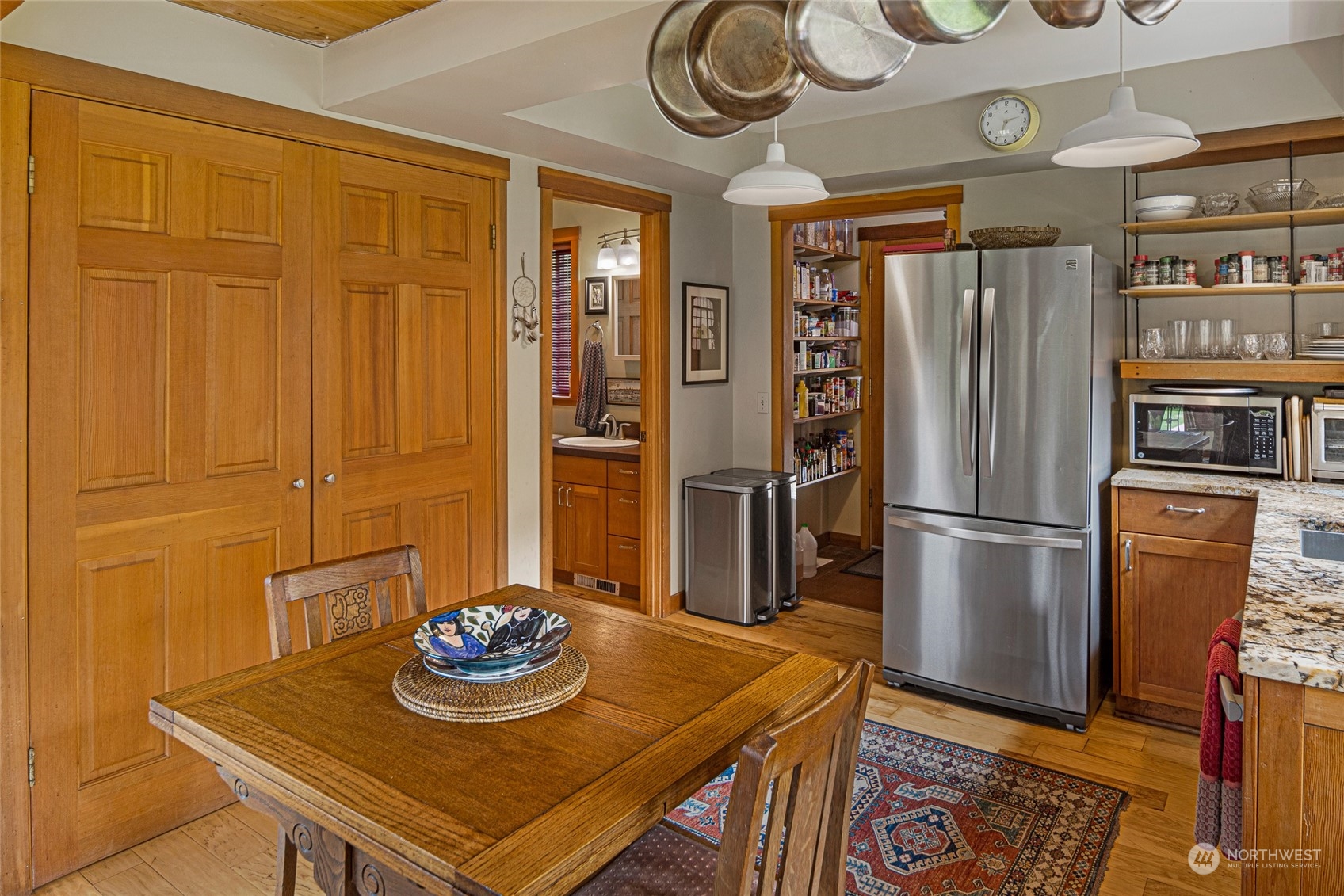 4484 Cattle Point Road Friday Harbor, WA 98250 - Photo 11 of 22 a kitchen with stainless steel appliances granite countertop a dining table and chairs