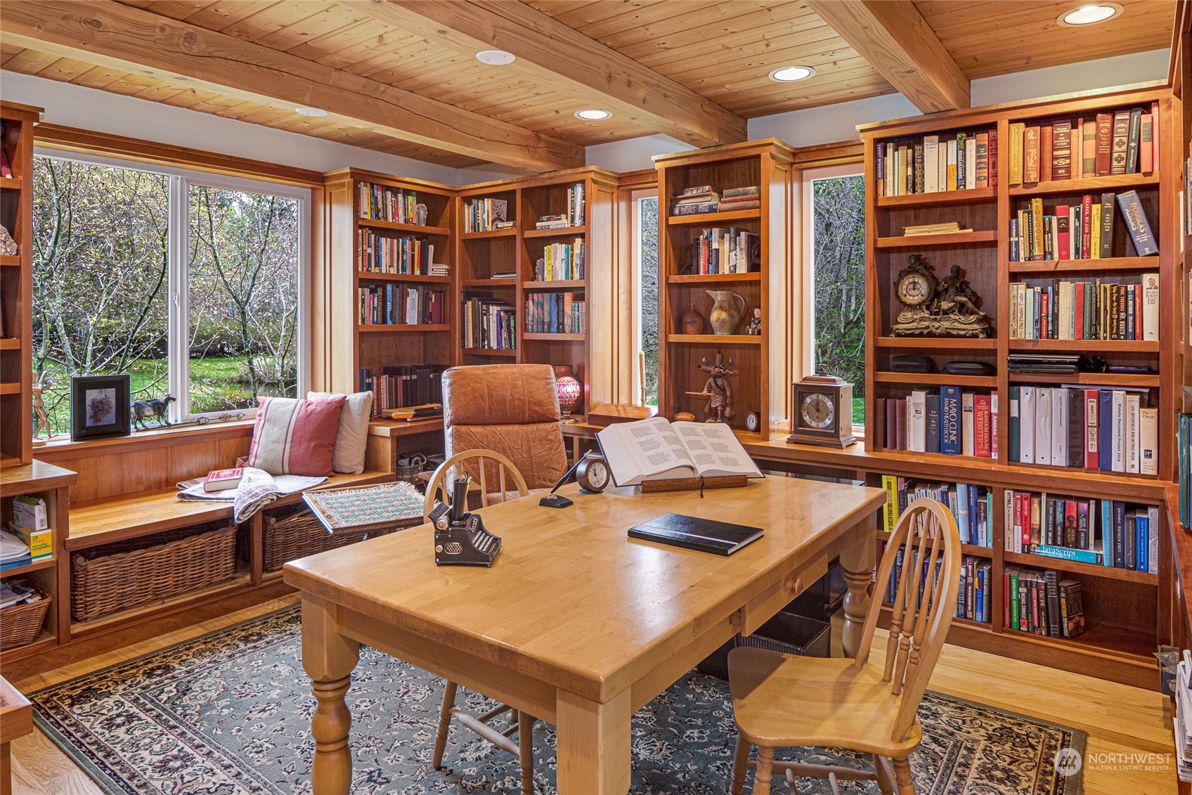 4484 Cattle Point Road Friday Harbor, WA 98250 - Photo 15 of 22 a work room with furniture and a book shelf
