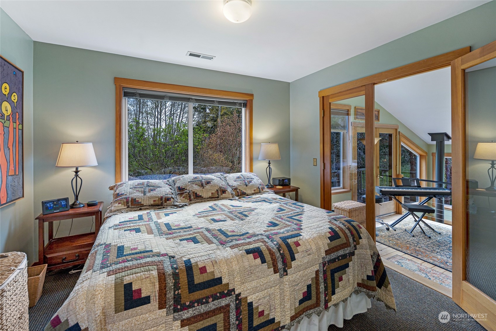 4484 Cattle Point Road Friday Harbor, WA 98250 - Photo 16 of 22 a bedroom with a bed and a large window
