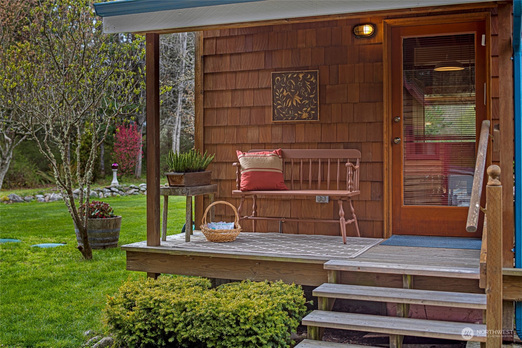 4484 Cattle Point Road Friday Harbor, WA 98250 - Photo 2 of 22 a view of a two chairs in the back yard of the house