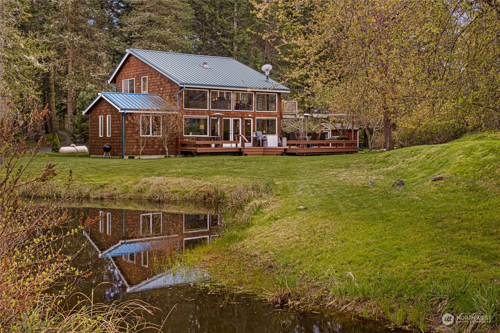 4484 Cattle Point Road Friday Harbor, WA 98250 - Photo 4 of 22 a aerial view of a house with swimming pool next to a yard