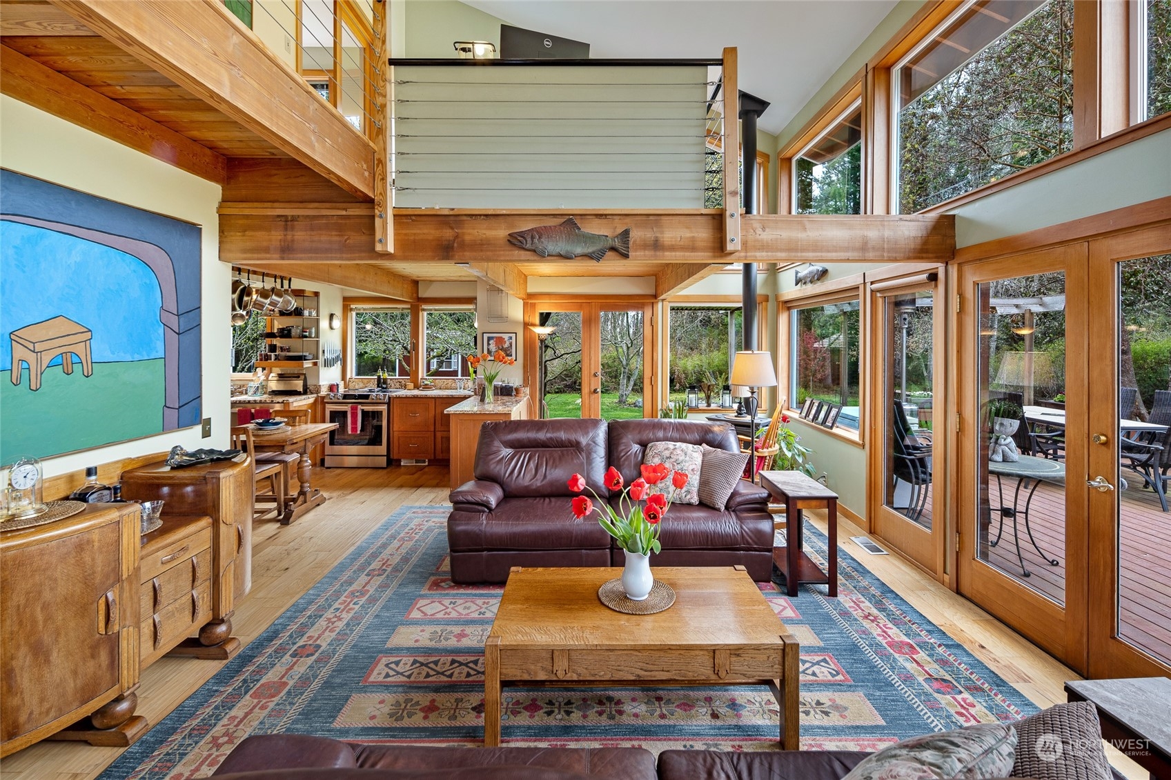 4484 Cattle Point Road Friday Harbor, WA 98250 - Photo 8 of 22 a living room with patio furniture and a fireplace