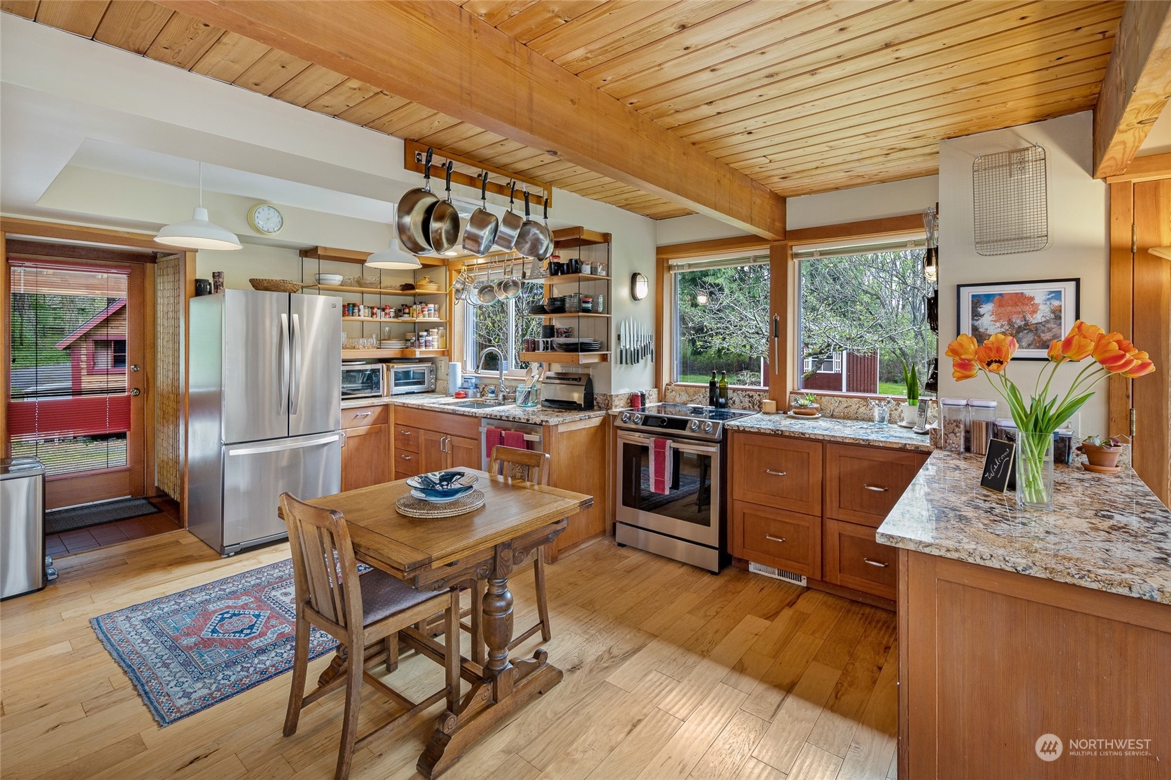 4484 Cattle Point Road Friday Harbor, WA 98250 - Photo 9 of 22 a living room with furniture a dining table and a potted plant
