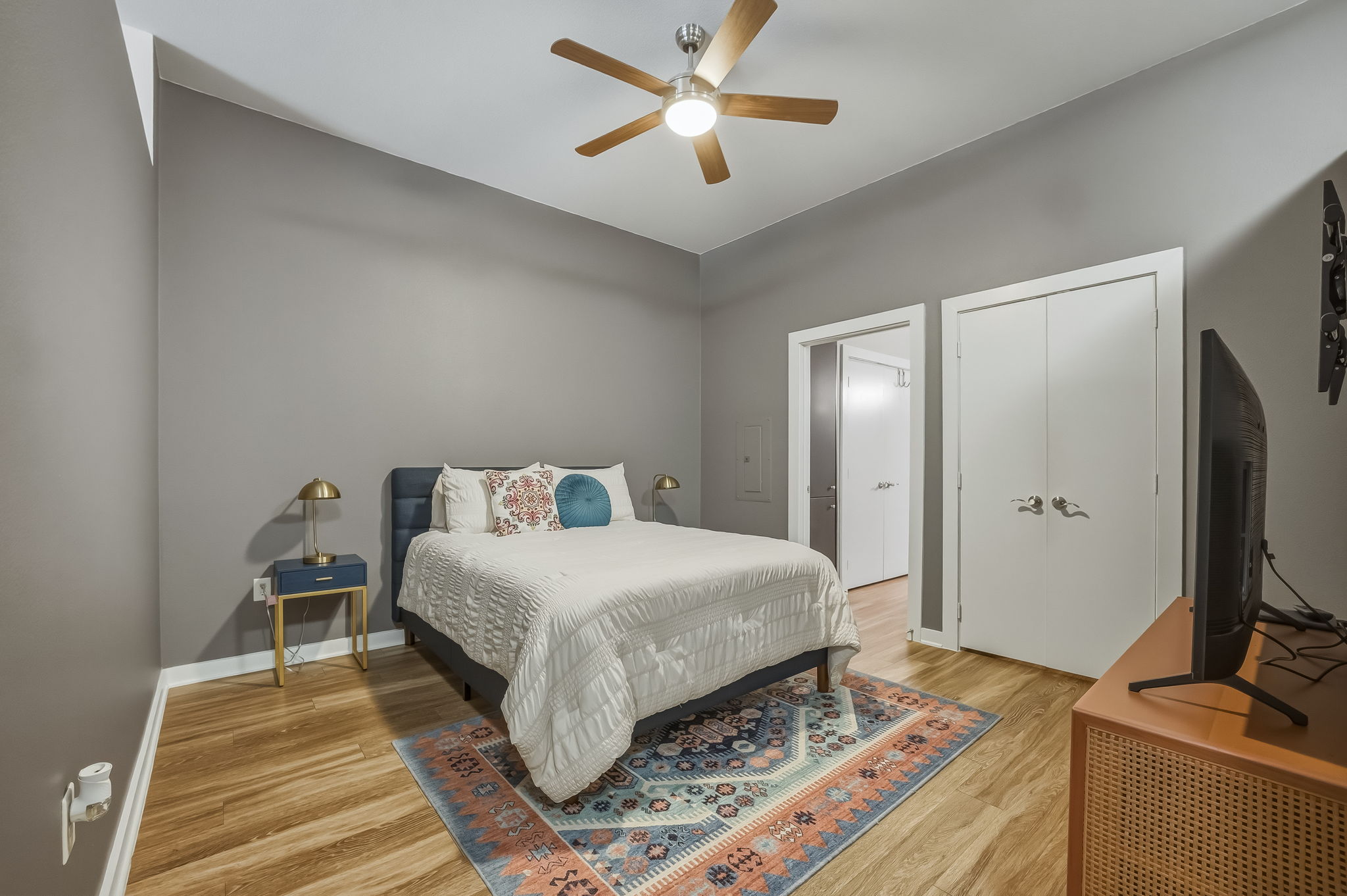 1900 Barton Springs Road, Unit 2006 Austin, TX 78704 - Photo 10 of 26 a bedroom with a bed and a flat screen tv
