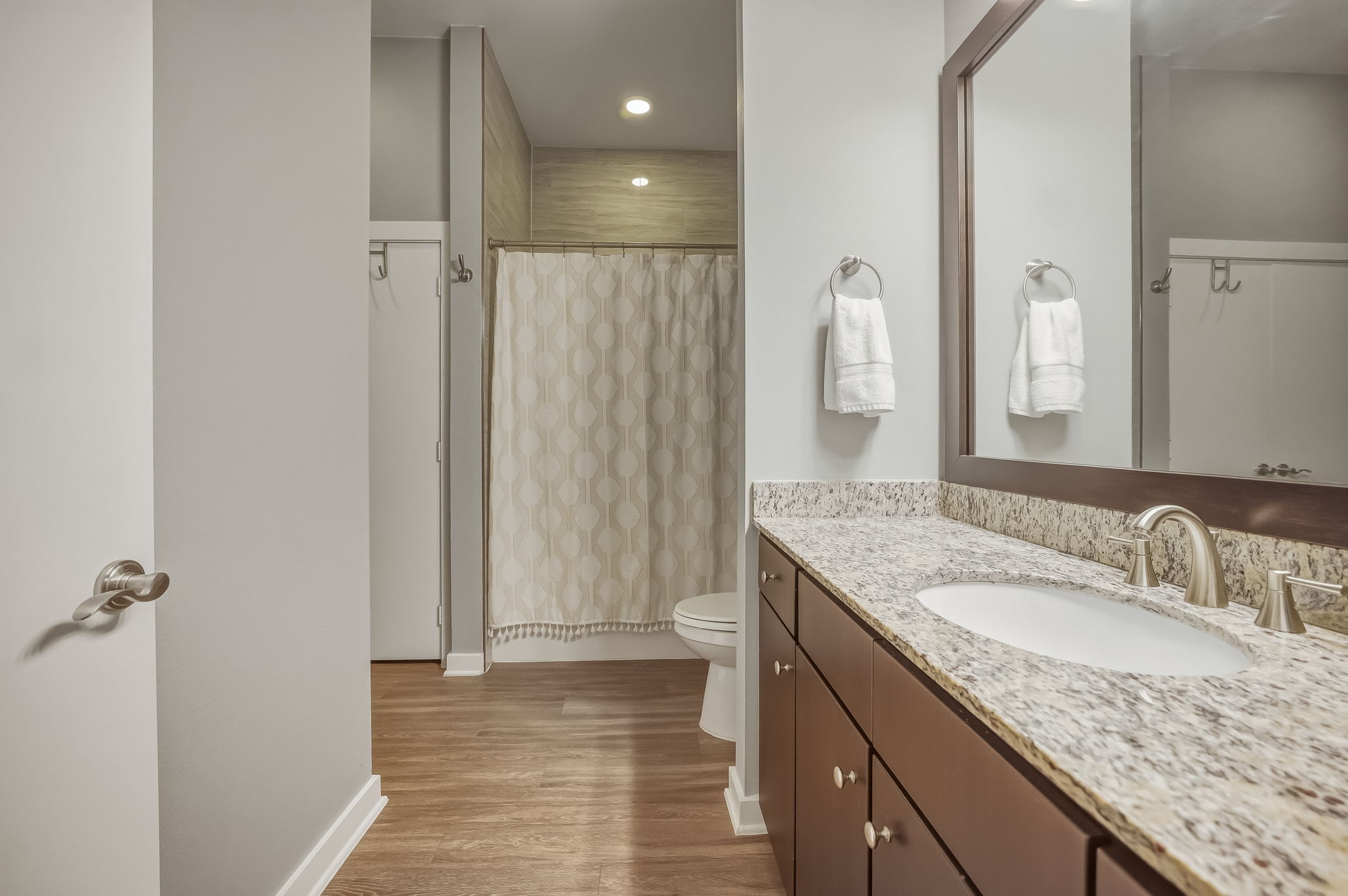 1900 Barton Springs Road, Unit 2006 Austin, TX 78704 - Photo 16 of 26 a bathroom with a granite countertop sink and a mirror