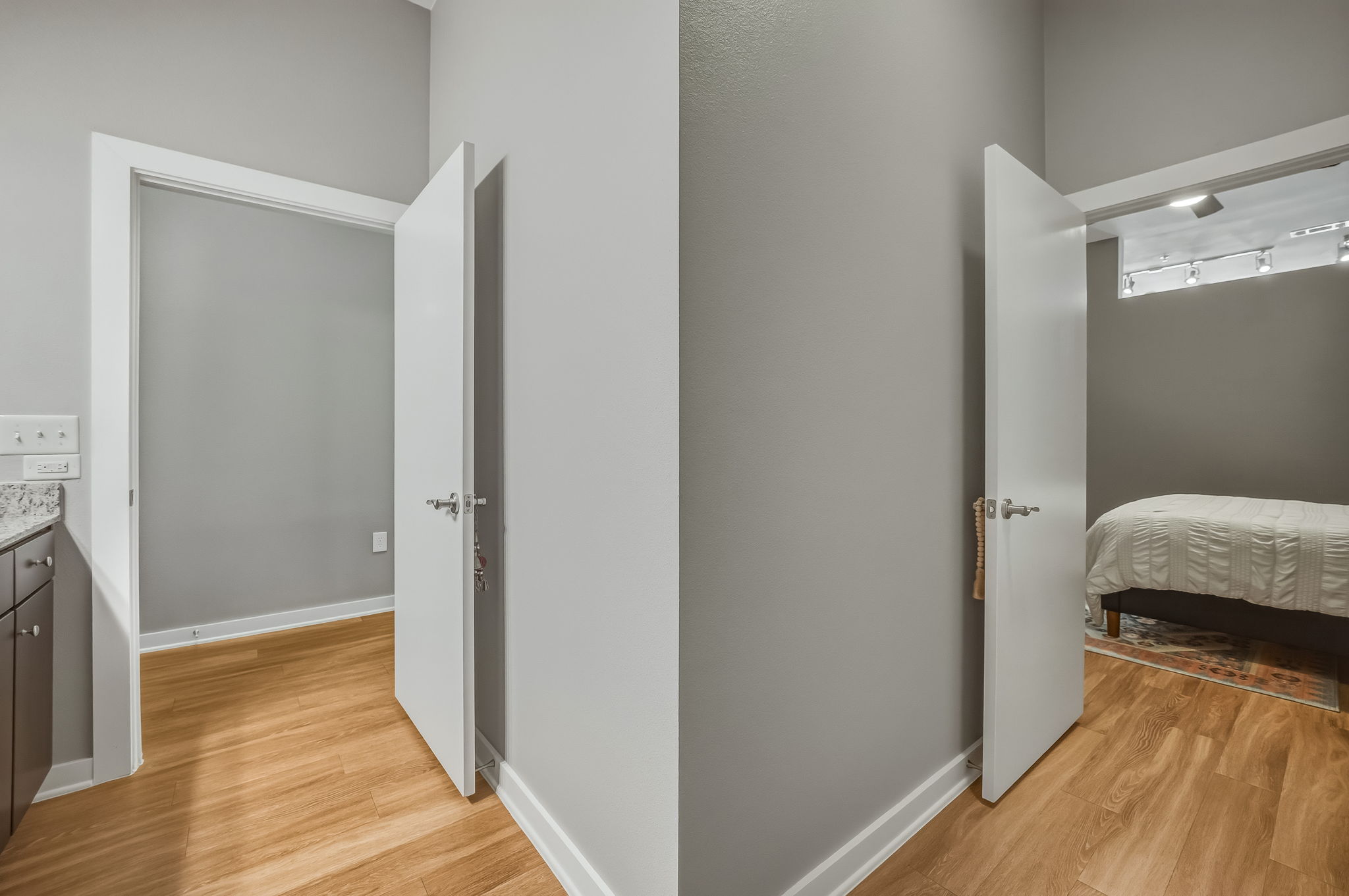 1900 Barton Springs Road, Unit 2006 Austin, TX 78704 - Photo 17 of 26 a view of a bedroom from a hallway