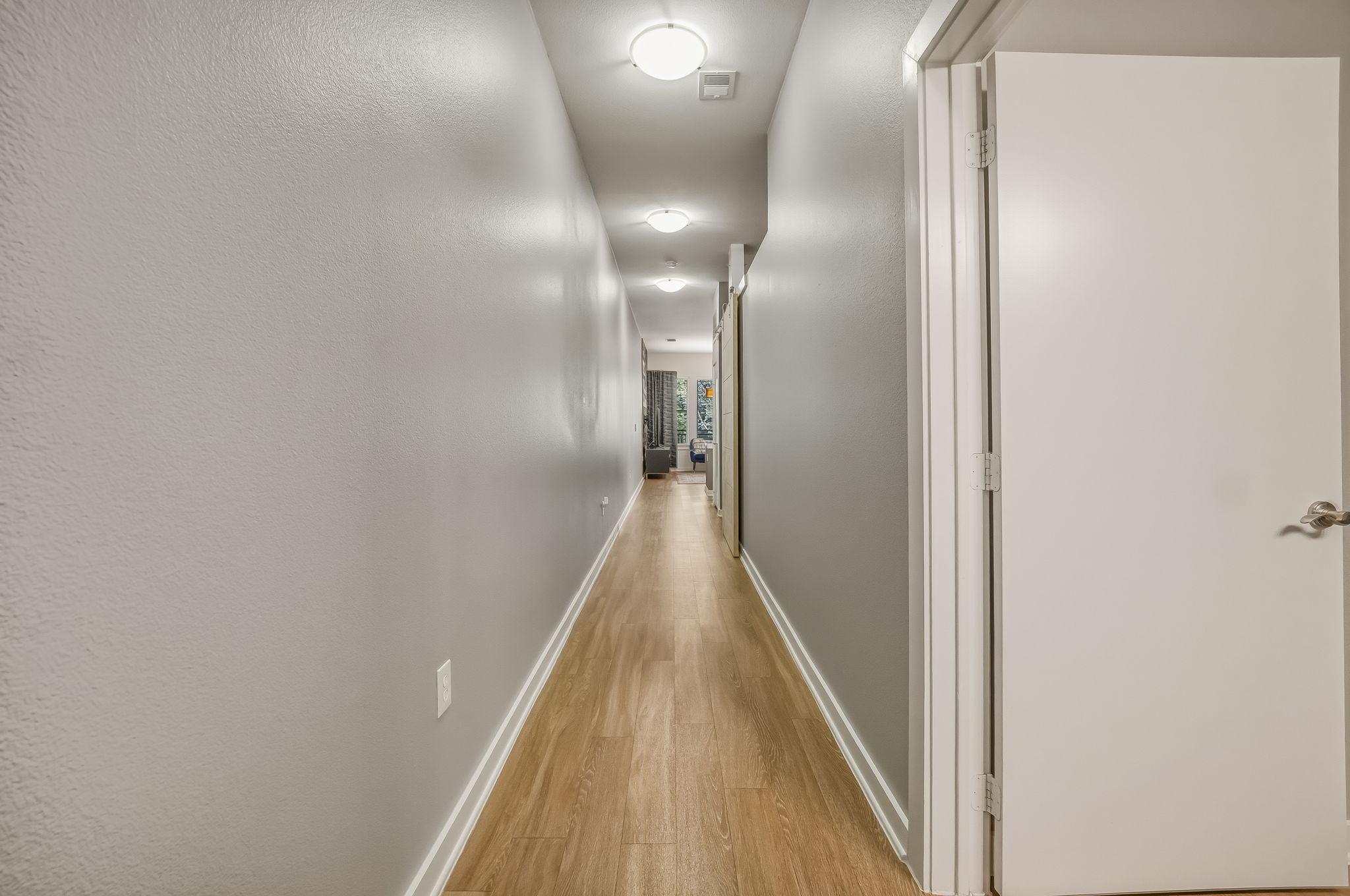 1900 Barton Springs Road, Unit 2006 Austin, TX 78704 - Photo 3 of 26 a view of a hallway with wooden floor