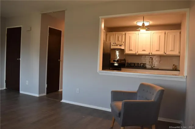 a view of a livingroom with furniture and window