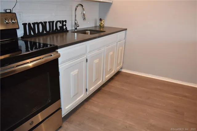 a kitchen with a sink and cabinets