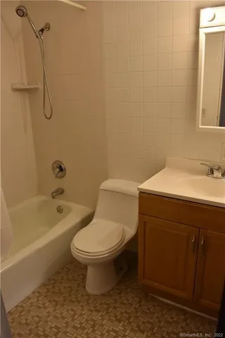 a bathroom with a sink a toilet and a bathtub
