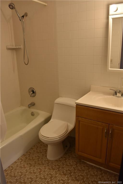 34 Bostwick Arms, Unit 34 New Milford, CT 06776 - Photo 6 of 11 a bathroom with a sink a toilet and a bathtub