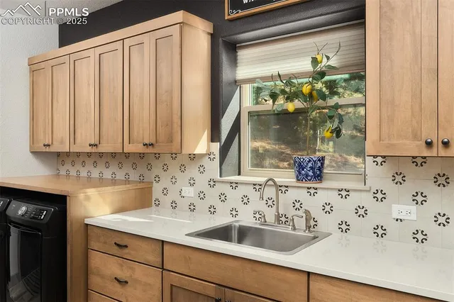 a kitchen with granite countertop a sink and a window
