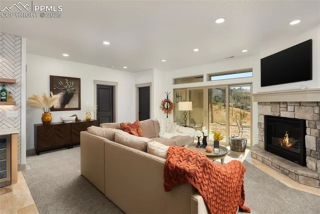 a living room with furniture fireplace and flat screen tv