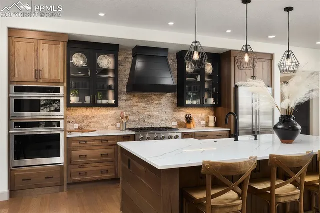 a kitchen with a sink and stove