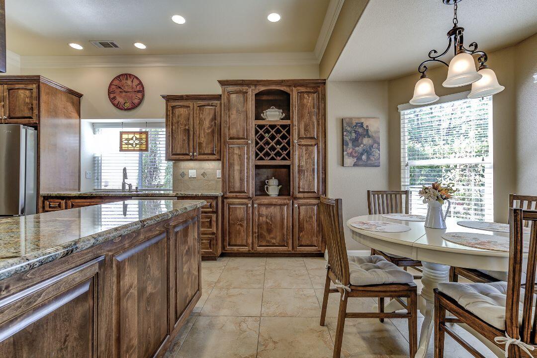 380 Franciscan Trail Redding, CA 96003 - Photo 14 of 78 a large kitchen with a table and chairs