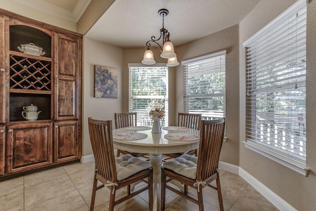 380 Franciscan Trail Redding, CA 96003 - Photo 15 of 78 a dining room with furniture window and outside view
