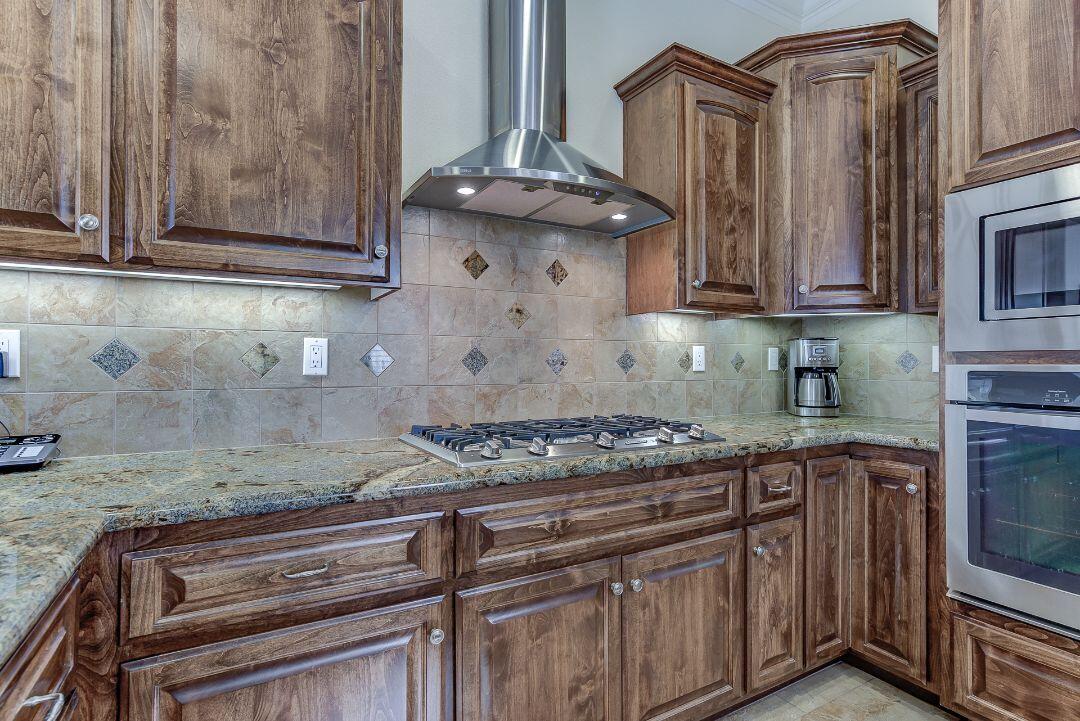 380 Franciscan Trail Redding, CA 96003 - Photo 19 of 78 a stove top oven sitting inside of a kitchen