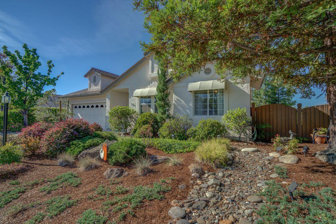 380 Franciscan Trail Redding, CA 96003 - Photo 2 of 78 a view of a house with a yard and tree s
