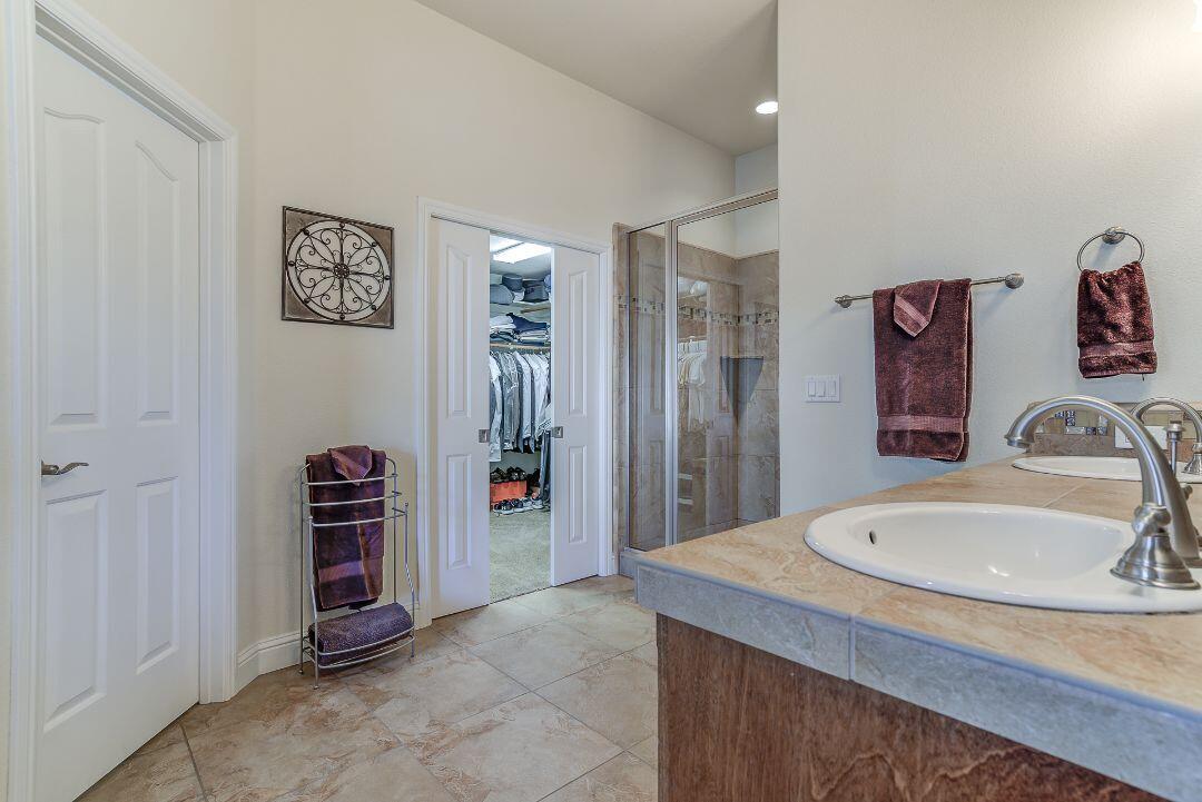 380 Franciscan Trail Redding, CA 96003 - Photo 31 of 78 a bathroom with a sink and a mirror