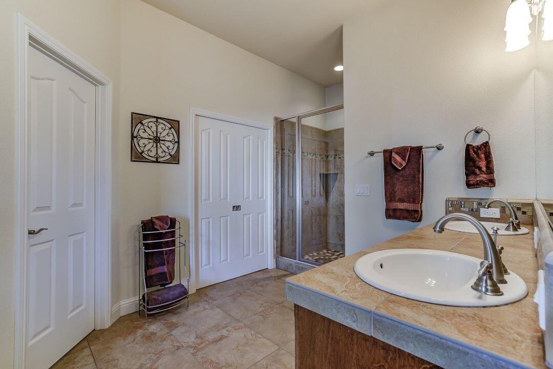 380 Franciscan Trail Redding, CA 96003 - Photo 34 of 78 a bathroom with a sink and a mirror