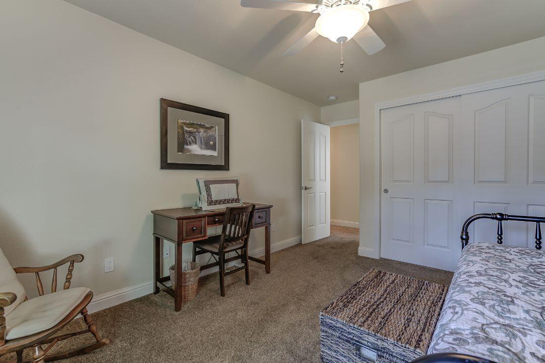 380 Franciscan Trail Redding, CA 96003 - Photo 37 of 78 a workspace with a table and a couch