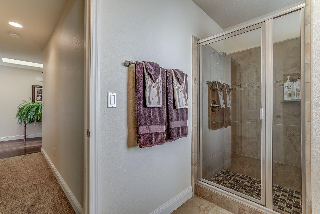380 Franciscan Trail Redding, CA 96003 - Photo 39 of 78 a bathroom with a shower and a mirror