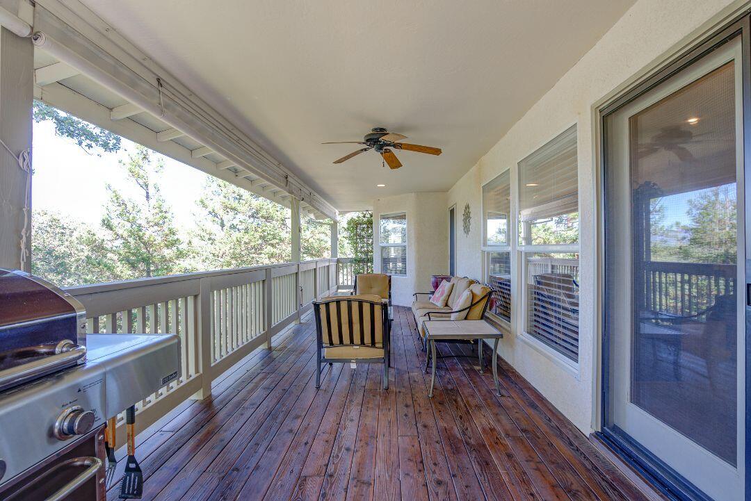 380 Franciscan Trail Redding, CA 96003 - Photo 42 of 78 a living room with furniture and a large window