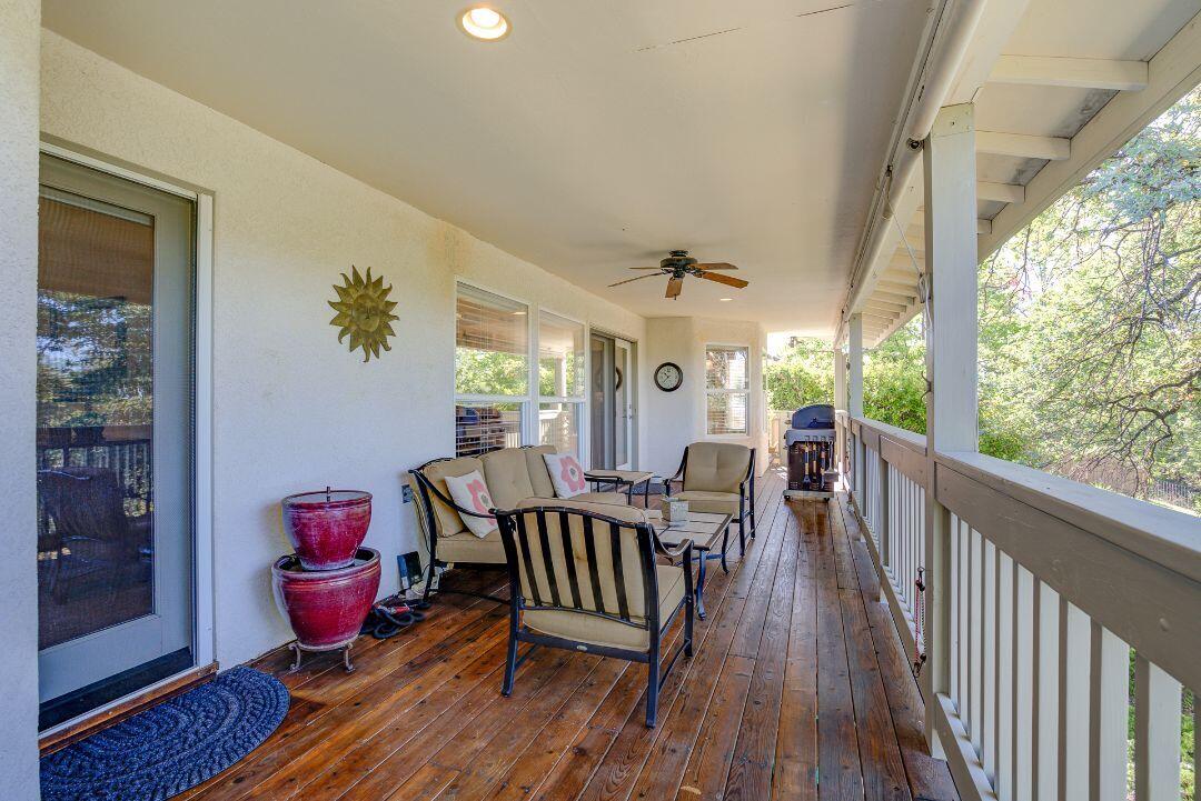 380 Franciscan Trail Redding, CA 96003 - Photo 43 of 78 a view of a dining room with furniture window and wooden floor