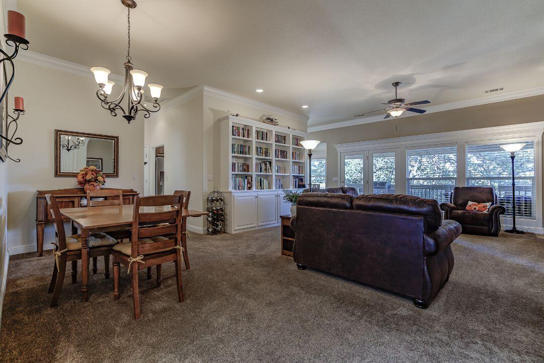 380 Franciscan Trail Redding, CA 96003 - Photo 8 of 78 a living room with furniture and a chandelier