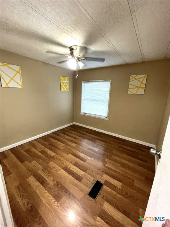 5576 Helm Lane Temple, TX 76502 - Photo 14 of 25 a view of a room with wooden floor and chandelier