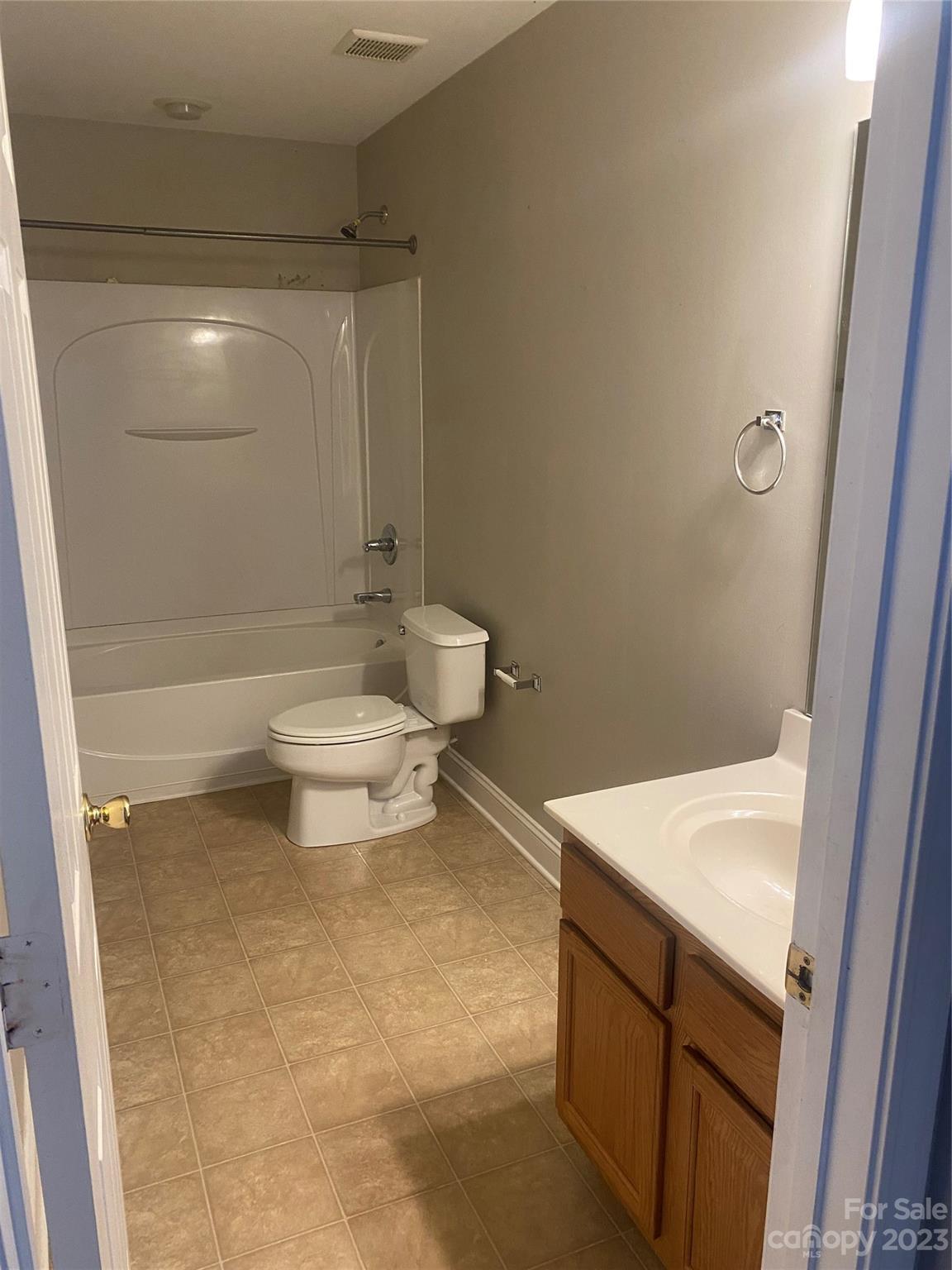 7808 Kuck Road Mint Hill, NC 28227 - Photo 25 of 34 a bathroom with a sink a toilet and shower