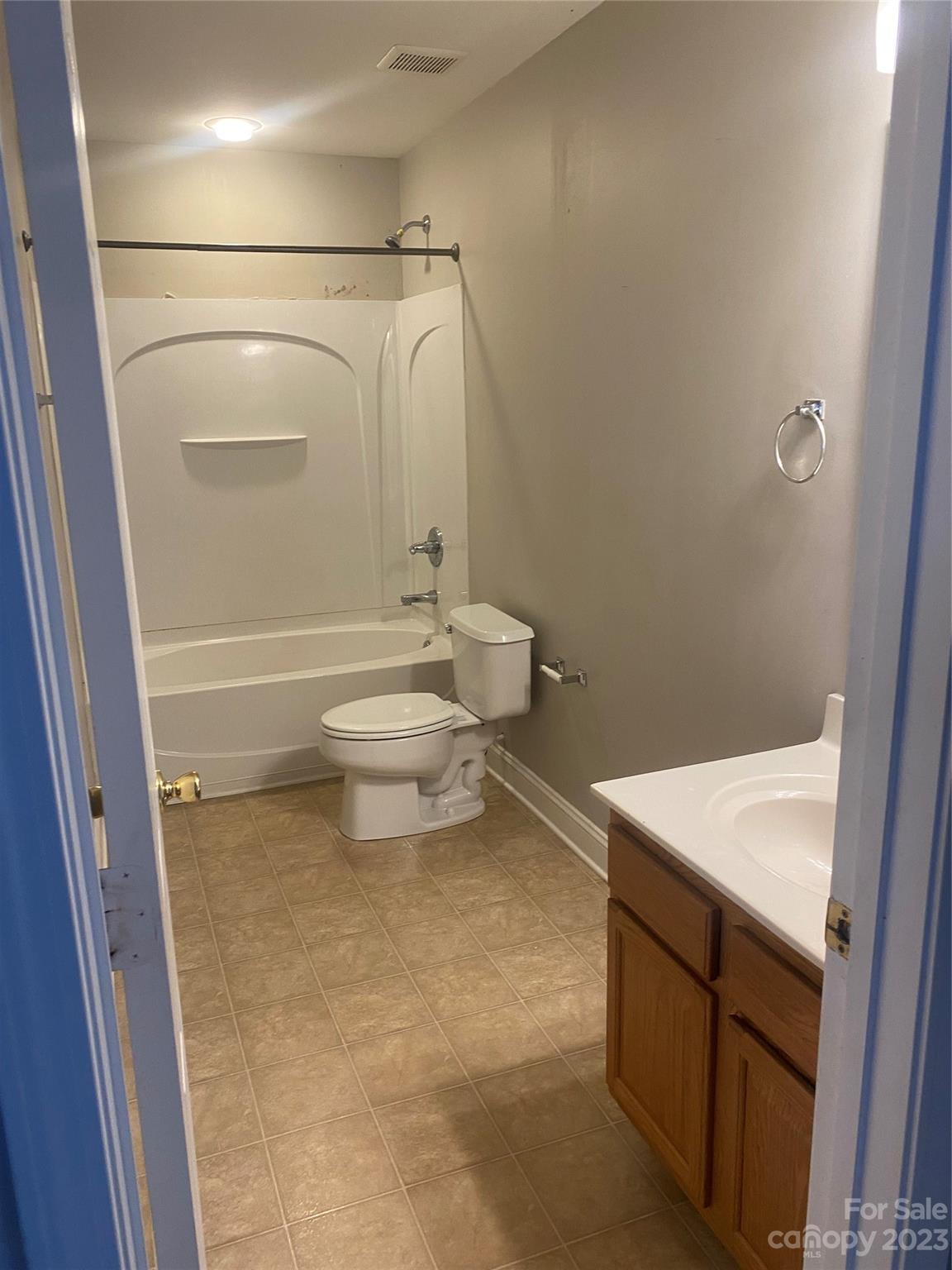 7808 Kuck Road Mint Hill, NC 28227 - Photo 26 of 34 a bathroom with a sink a toilet and shower