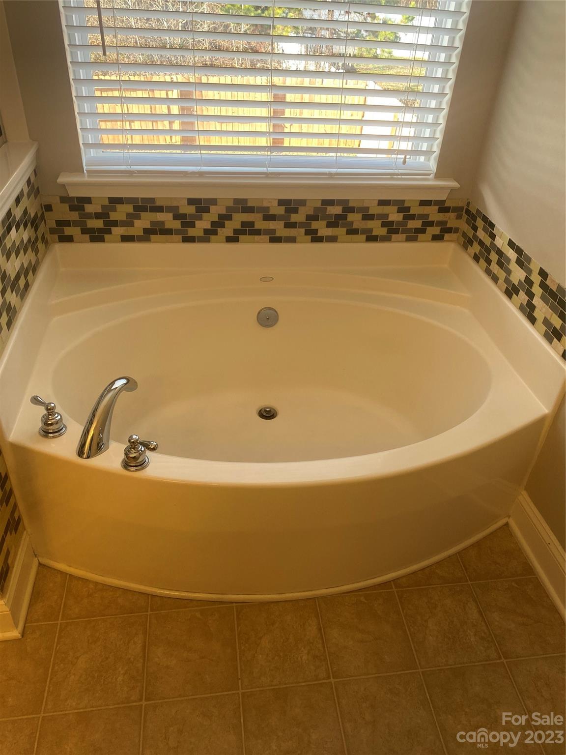 7808 Kuck Road Mint Hill, NC 28227 - Photo 33 of 34 a bathroom with a bathtub and window