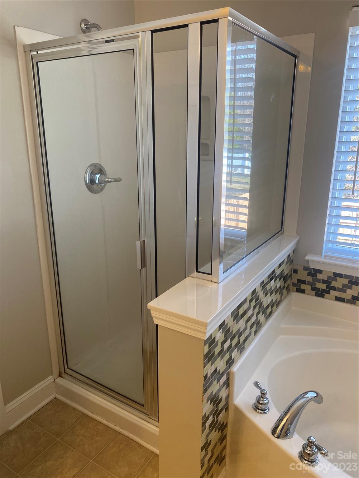 7808 Kuck Road Mint Hill, NC 28227 - Photo 34 of 34 a bathroom with a tub and a sink