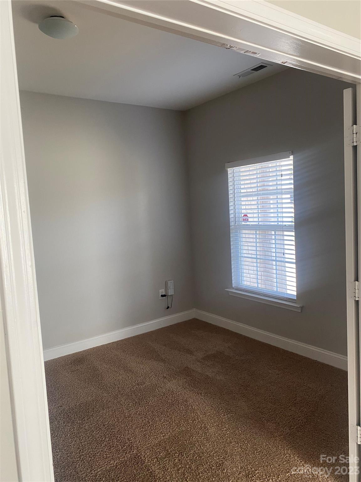 7808 Kuck Road Mint Hill, NC 28227 - Photo 7 of 34 an empty room with a window