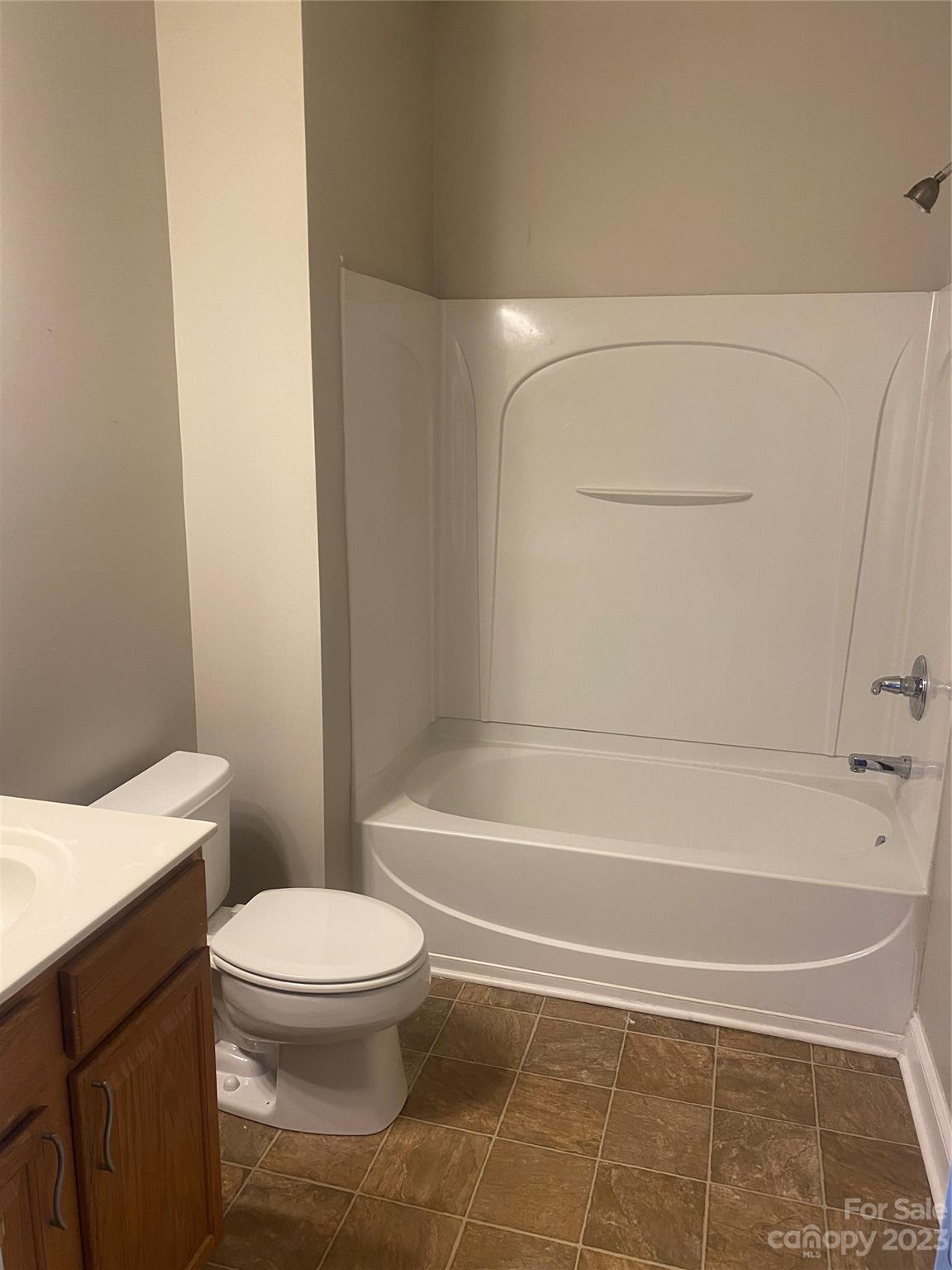 7808 Kuck Road Mint Hill, NC 28227 - Photo 8 of 34 a bathroom with a toilet and a shower