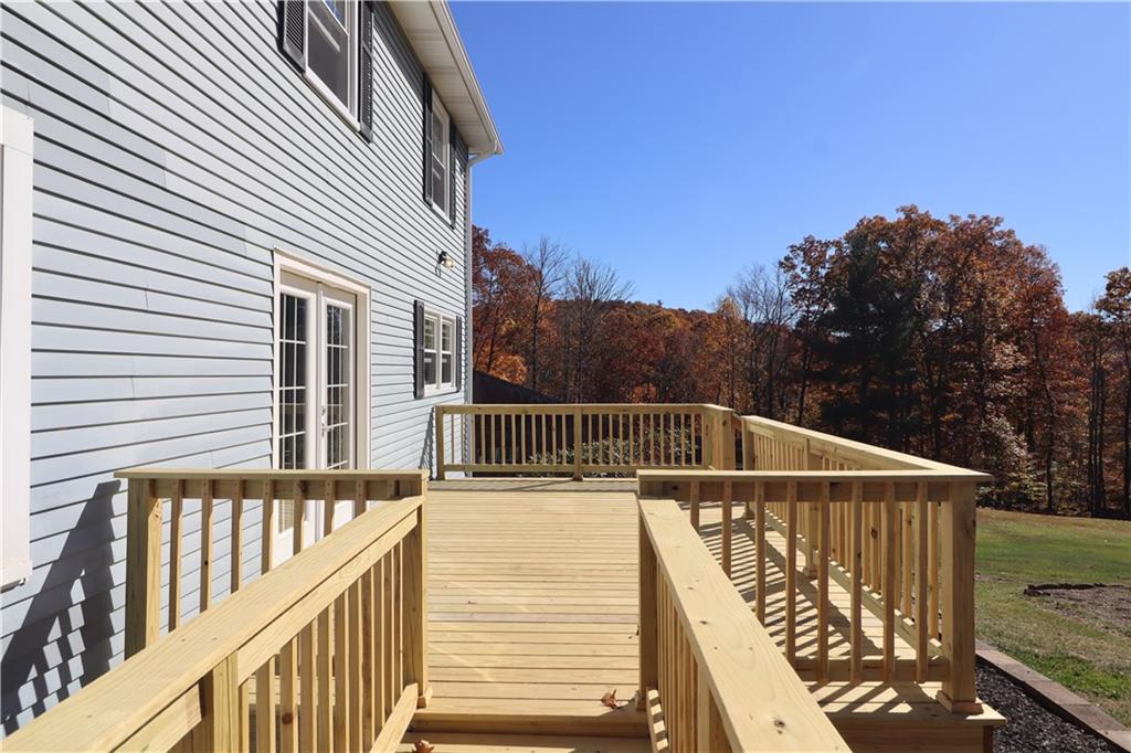 236 Smith Road Franklin, PA 16323 - Photo 18 of 22 a view of balcony with wooden floor and fence and trees