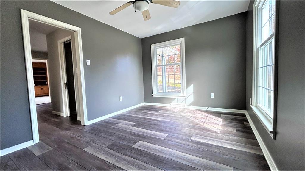 236 Smith Road Franklin, PA 16323 - Photo 5 of 22 a view of an empty room with window and wooden floor
